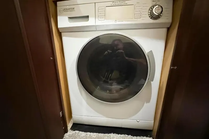 Slide: The Image of Equator washer-dryer in 2006 Sea Ray 580 Sedan Bridge yacht interior. - 46