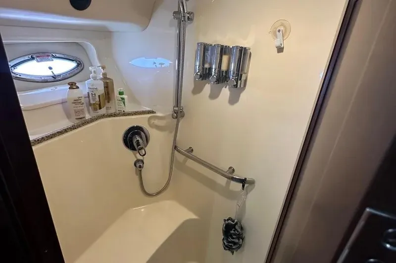 Slide: The Image of Shower area in 2006 Sea Ray 580 Sedan Bridge yacht with toiletries and dispensers. - 53