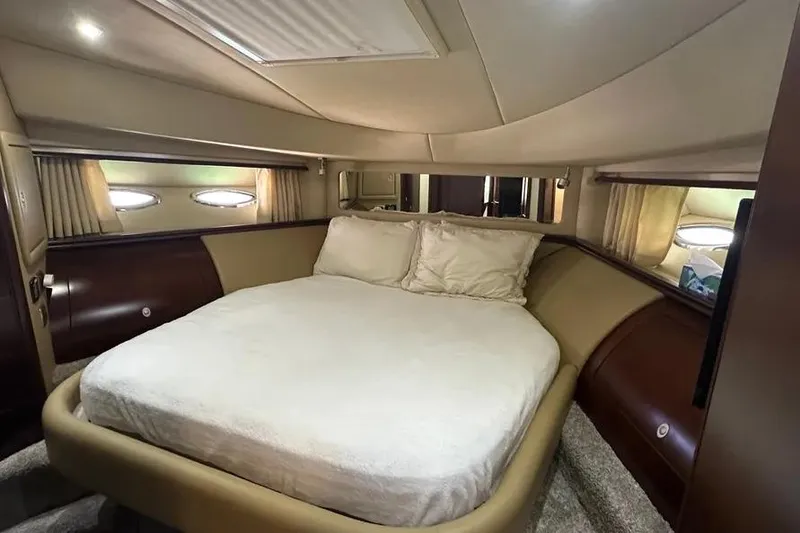 Slide: The Image of Luxurious bedroom interior of 2006 Sea Ray 580 Sedan Bridge yacht. - 56