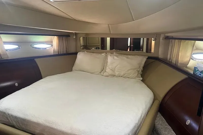 Slide: The Image of Luxurious bedroom interior of 2006 Sea Ray 580 Sedan Bridge yacht. - 62