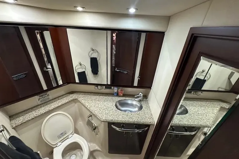 Slide: The Image of Luxurious bathroom in 2006 Sea Ray 580 Sedan Bridge yacht with granite countertop. - 66