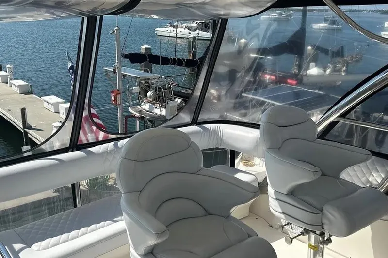 Slide: The Image of Luxurious interior of 2006 Sea Ray 580 Sedan Bridge yacht with marina view. - 68