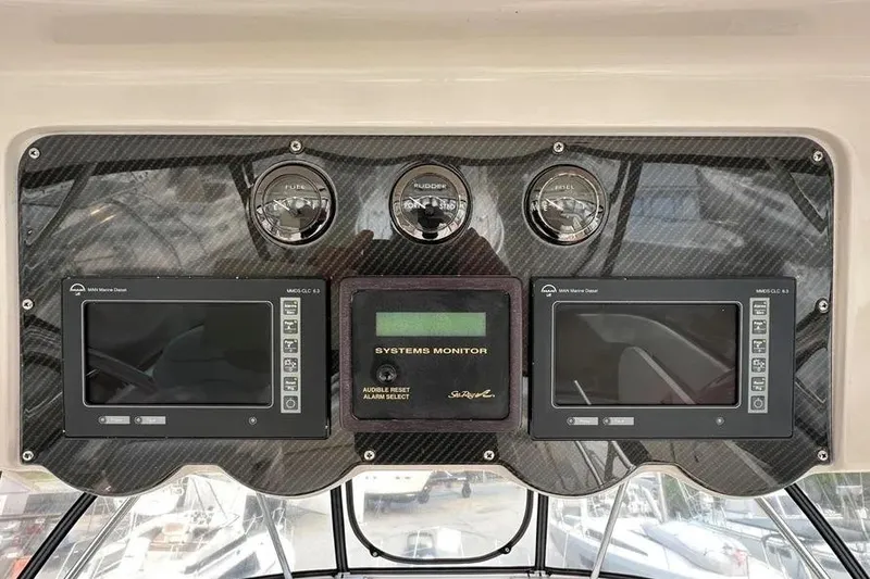 Slide: The Image of 2006 Sea Ray 580 Sedan Bridge dashboard with gauges and systems monitor. - 8