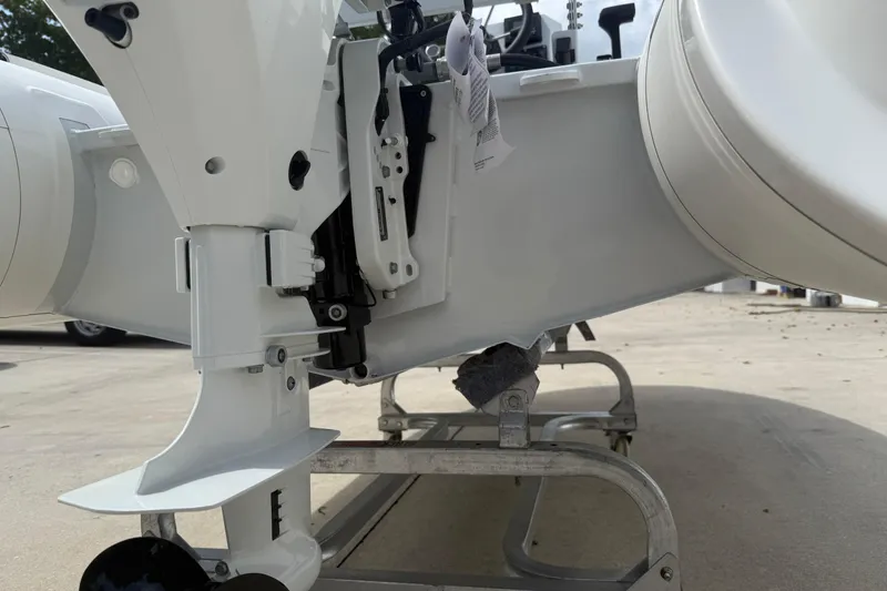 Slide: The Image of Close-up of East Marine 320 boat motor, 2026 model, on a stand. - 10