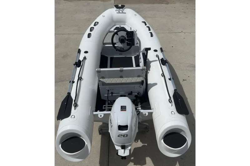 Slide: The Image of 2026 East Marine 320 inflatable boat with outboard motor, top view. - 13