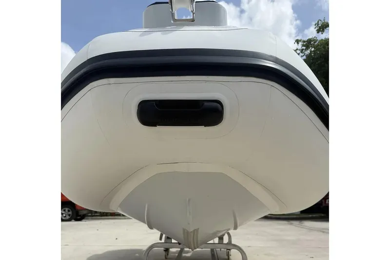 Slide: The Image of Manufacturer Provided Image: Front view of 2025 East Marine 320 boat, showcasing sleek design and modern features. - 5