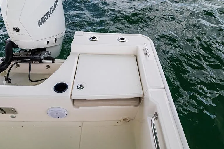 Slide: The Image of Manufacturer Provided Image: 2026 Boston Whaler 210 Montauk boat stern with Mercury engine on water. - 15