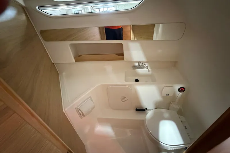 Slide: The Image of Compact bathroom in 2025 Nimbus Weekender 9 boat with sink and toilet. - 11