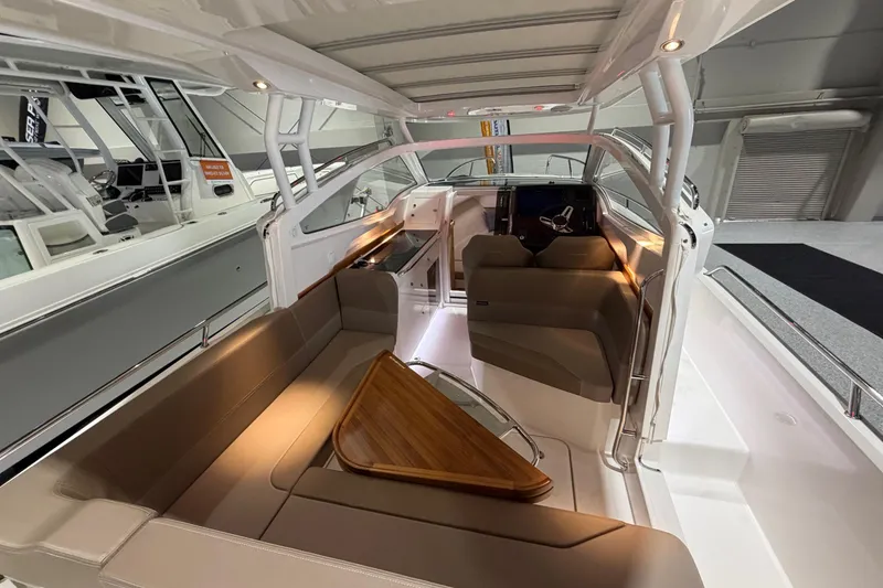 Slide: The Image of Luxurious interior of 2025 Nimbus Weekender 9 boat with seating and helm. - 15
