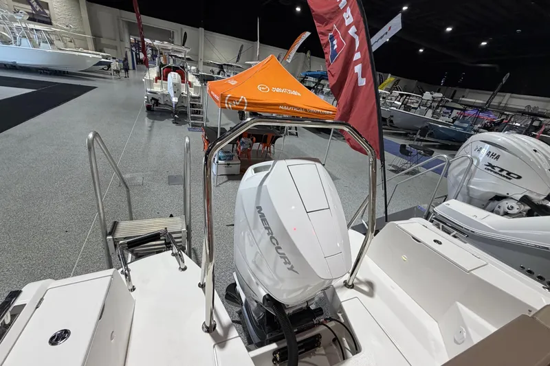 Slide: The Image of Nimbus Weekender 9 boat with Mercury engine at indoor boat show, 2025 model. - 16
