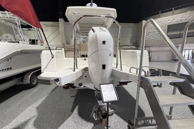 Slide: The Image of 2025 Nimbus Weekender 9 boat displayed indoors, featuring a sleek design and modern outboard motor. - 3