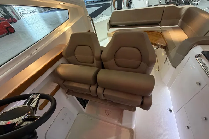 Slide: The Image of Interior of 2025 Nimbus Weekender 9 boat with plush seating and modern design. - 7