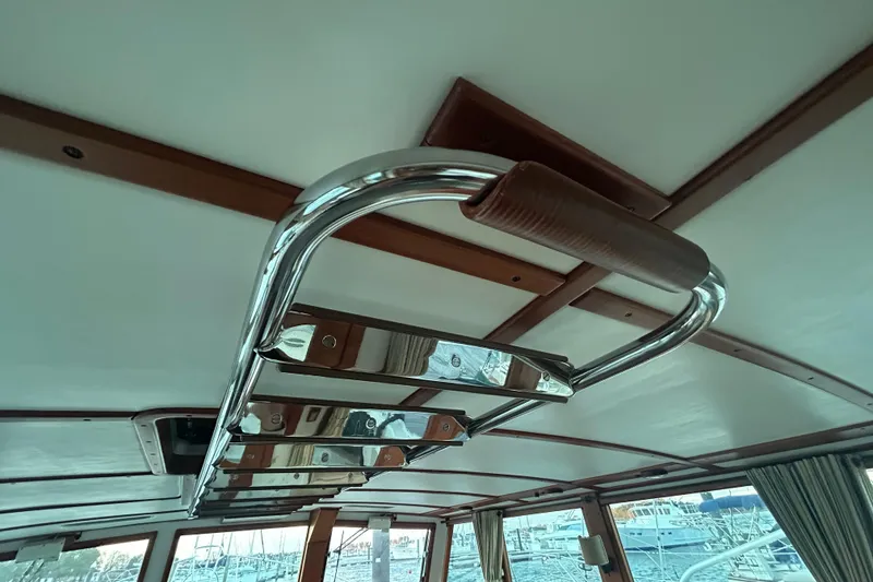 Slide: The Image of Interior view of a 1991 Holland 38 boat with a polished metal handrail. - 28
