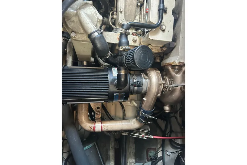 Slide: The Image of Engine of a 1991 Holland 38 boat, showcasing intricate mechanical components. - 33