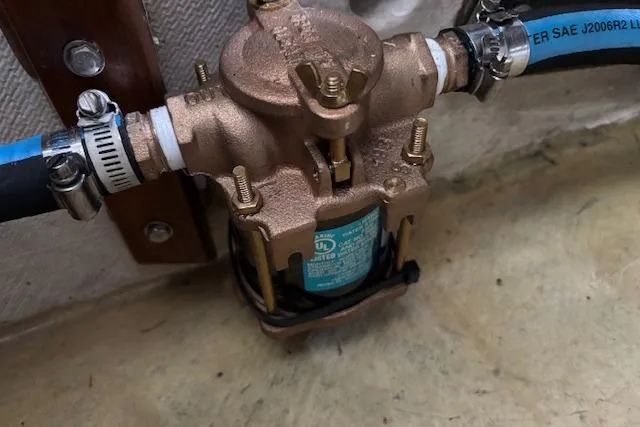 Slide: The Image of Bronze marine pump with blue hoses, Holland 38 model, 1991. - 34