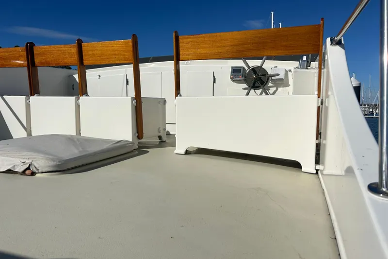 Slide: The Image of Deck of 1991 Holland 38 boat with wooden seats and steering wheel. - 39