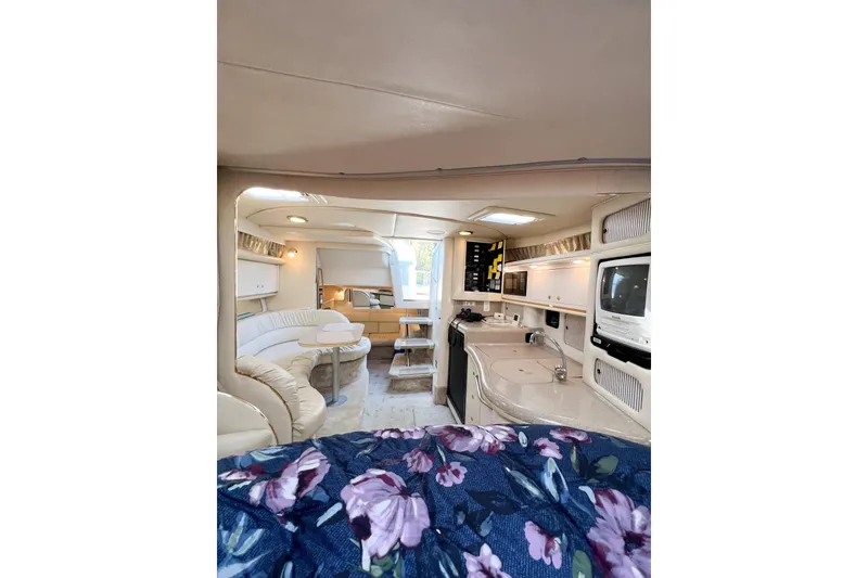 Slide: The Image of Interior of 2000 Sea Ray 340 Sundancer yacht with cozy seating and modern amenities. - 18
