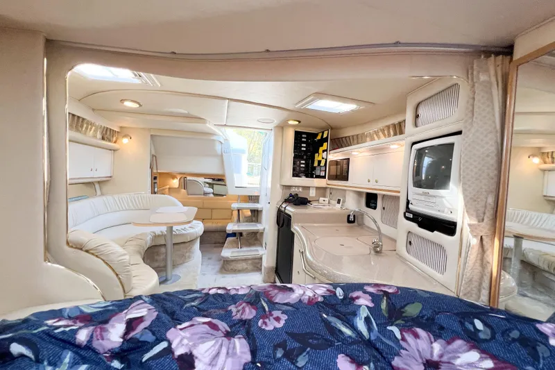 Slide: The Image of Interior of 2000 Sea Ray 340 Sundancer yacht with cozy seating and modern amenities. - 19