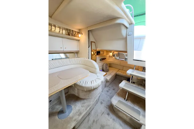 Slide: The Image of Interior of 2000 Sea Ray 340 Sundancer yacht with cozy seating and elegant design. - 20