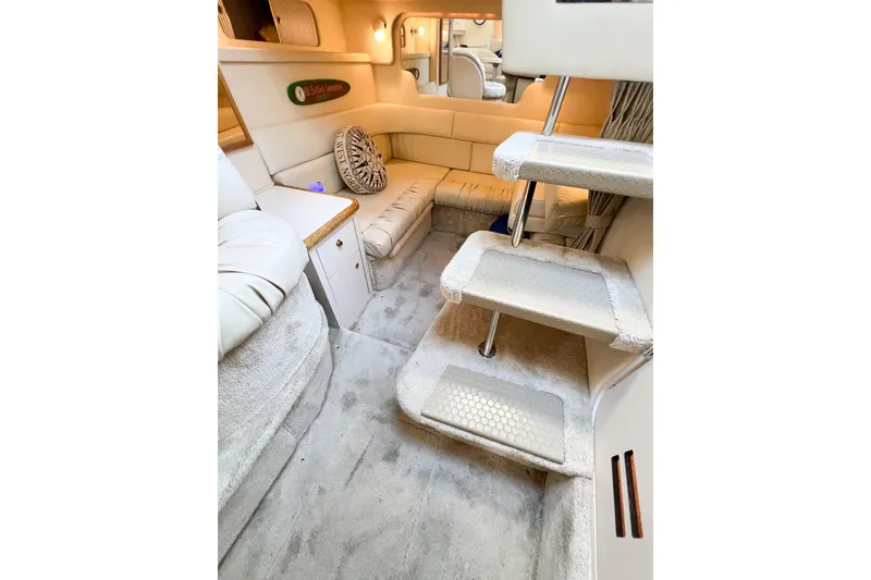 Slide: The Image of Interior of 2000 Sea Ray 340 Sundancer yacht with plush seating and carpeted stairs. - 31
