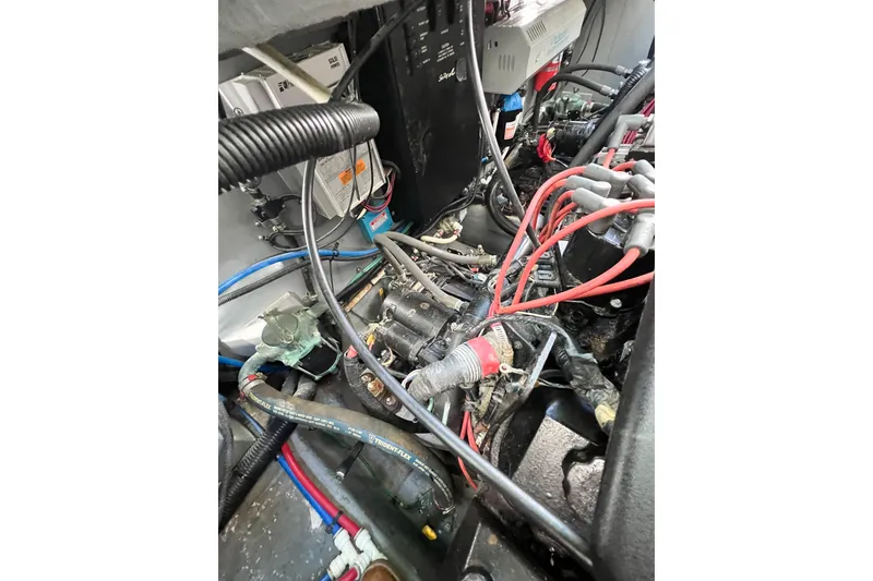 Slide: The Image of Engine compartment of a 2000 Sea Ray 340 Sundancer with visible wiring and components. - 37