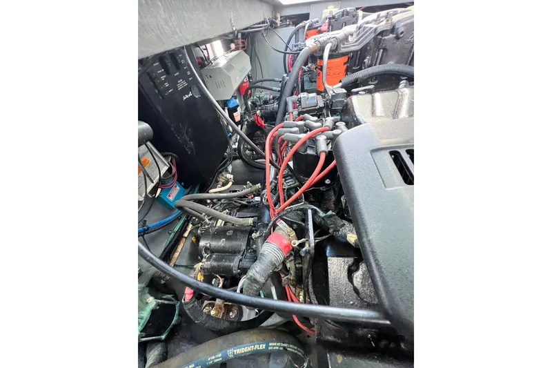 Slide: The Image of Engine compartment of a 2000 Sea Ray 340 Sundancer with visible wiring and components. - 38