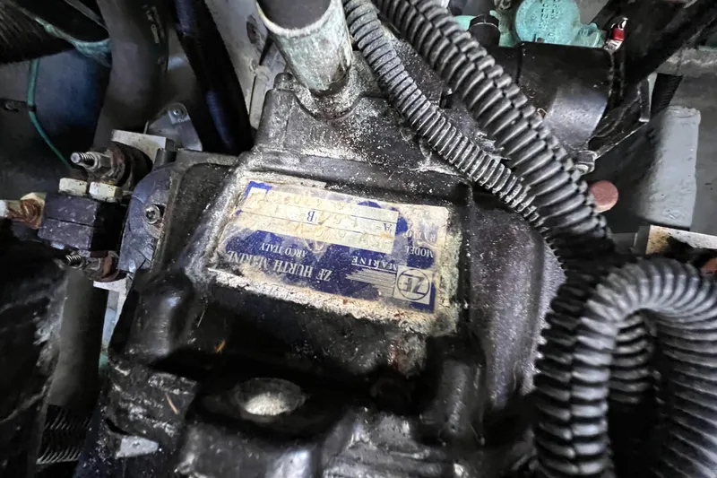 Slide: The Image of Engine component of a 2000 Sea Ray 340 Sundancer boat, showing wiring and label. - 39
