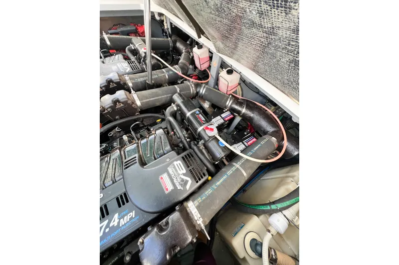 Slide: The Image of Engine compartment of a 2000 Sea Ray 340 Sundancer boat, showcasing dual engines. - 40