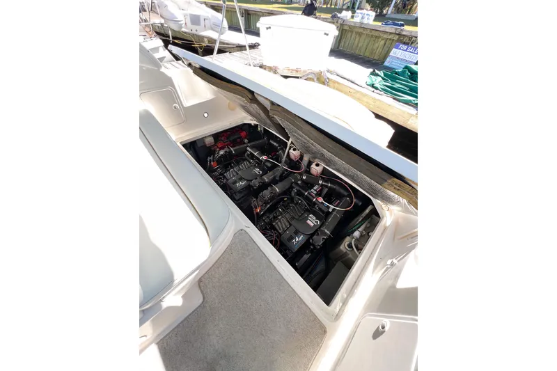 Slide: The Image of Engine compartment of 2000 Sea Ray 340 Sundancer boat, showing detailed mechanical components. - 41
