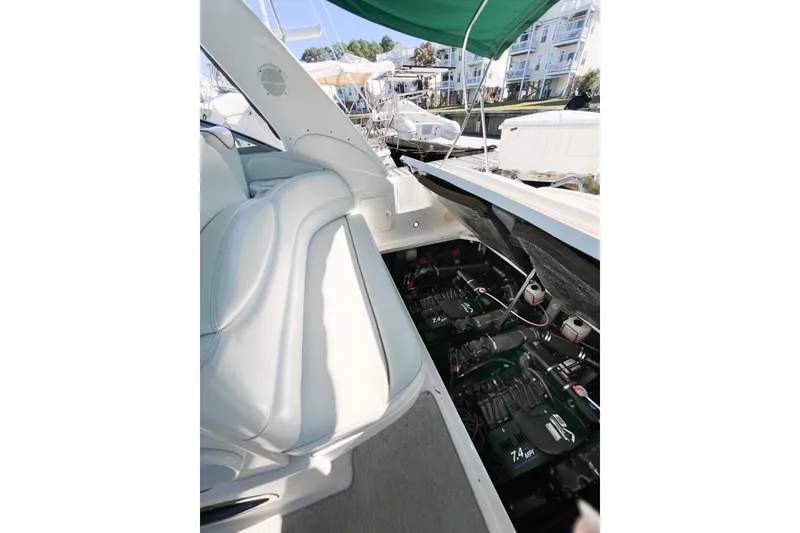 Slide: The Image of 2000 Sea Ray 340 Sundancer engine compartment with open hatch, showcasing dual engines. - 42