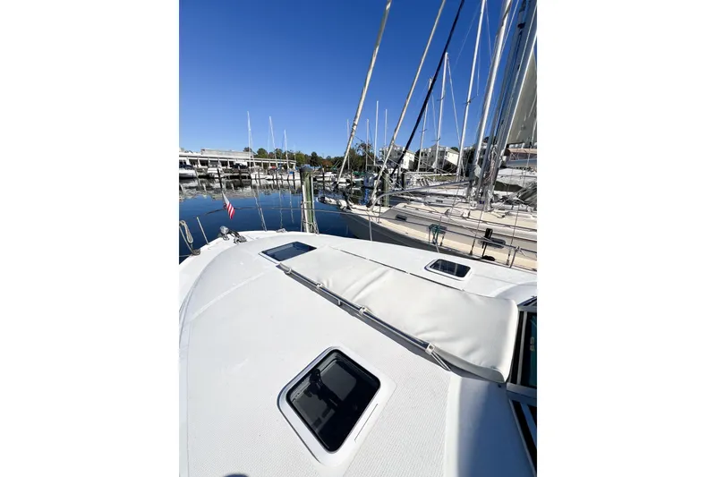Slide: The Image of 2000 Sea Ray 340 Sundancer yacht docked at marina under clear blue sky. - 44