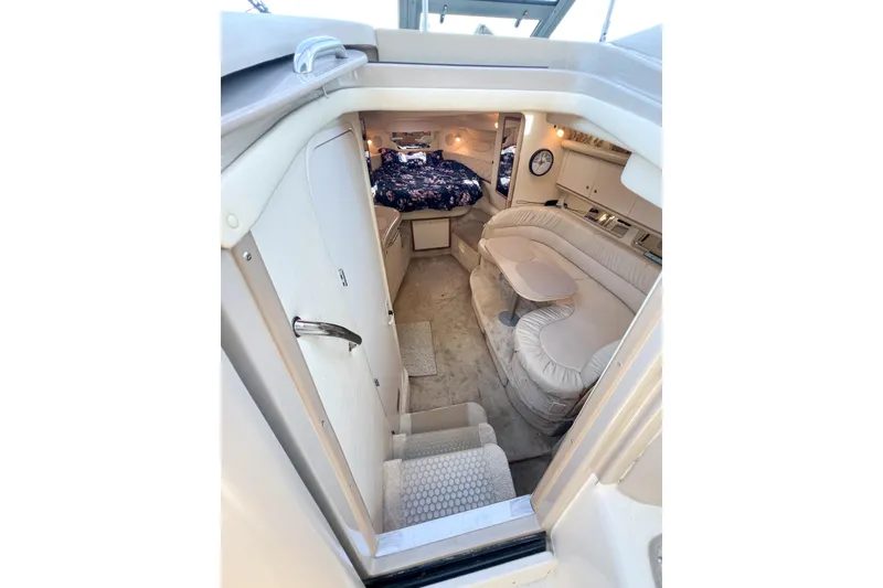 Slide: The Image of Interior of 2000 Sea Ray 340 Sundancer yacht with cozy seating and sleeping area. - 49