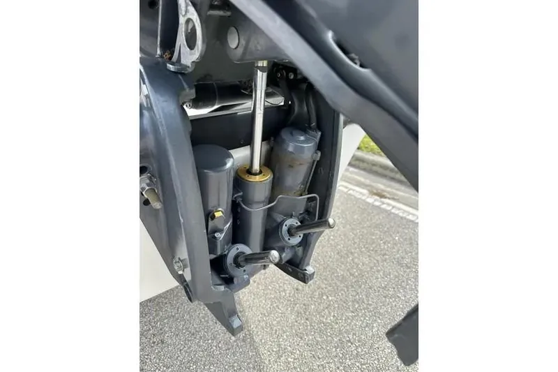 Slide: The Image of Close-up of a 2001 Century 2300 Center Console boat engine components. - 9