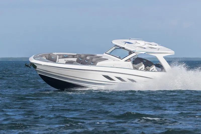 Slide: The Image of 2025 Deep Impact 499 Sport boat cruising on open water. - 11