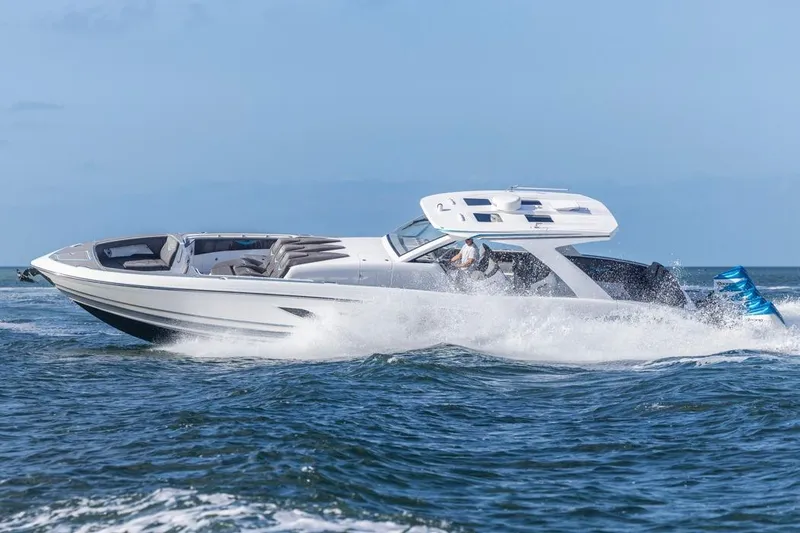 Slide: The Image of 2025 Deep Impact 499 Sport boat cruising on open water, showcasing sleek design and performance. - 12