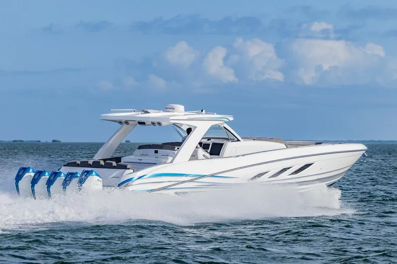 Slide: The Image of 2025 Deep Impact 499 Sport boat cruising on open water, showcasing sleek design and powerful engines. - 15