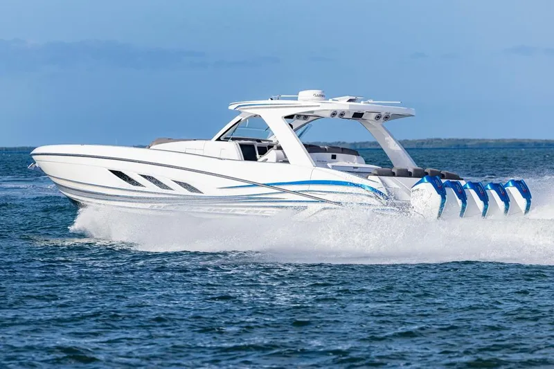 Slide: The Image of 2025 Deep Impact 499 Sport boat speeding on open water, showcasing sleek design and powerful engines. - 16