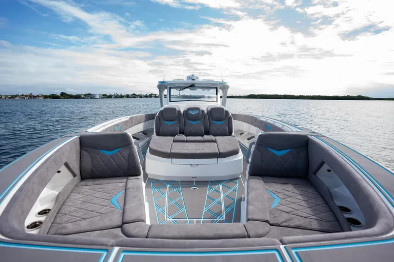 Slide: The Image of Luxury 2025 Deep Impact 499 Sport boat with spacious seating on calm water. - 21