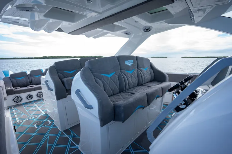 Slide: The Image of Interior of 2025 Deep Impact 499 Sport boat with luxurious seating and modern design. - 25