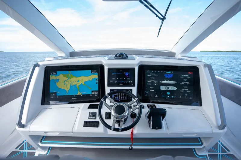 Slide: The Image of Cockpit of 2025 Deep Impact 499 Sport boat with advanced navigation displays. - 26