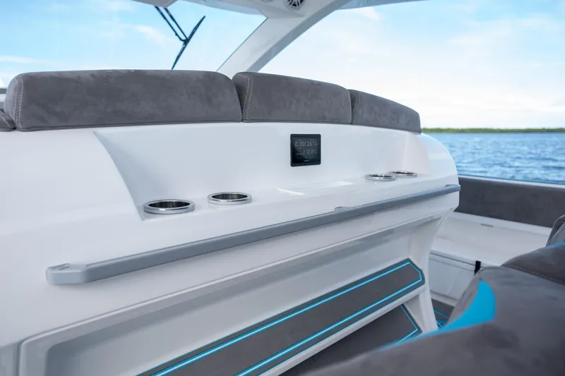 Slide: The Image of Interior of 2025 Deep Impact 499 Sport boat with modern seating and cup holders. - 30