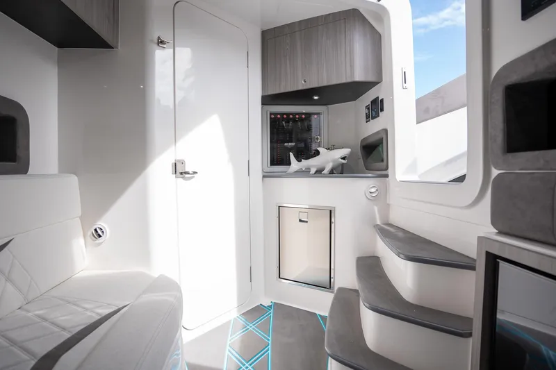 Slide: The Image of Interior of 2025 Deep Impact 499 Sport boat, featuring modern design and sleek furnishings. - 32