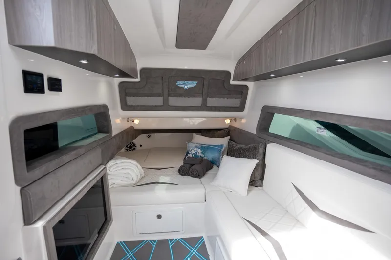 Slide: The Image of Luxurious interior of 2025 Deep Impact 499 Sport boat with modern design and cozy seating. - 33