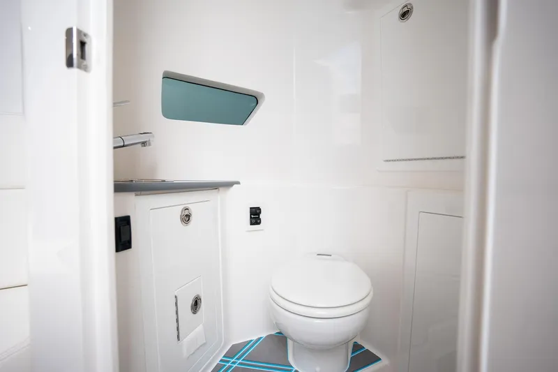 Slide: The Image of 2025 Deep Impact 499 Sport boat bathroom with modern fixtures and sleek design. - 34