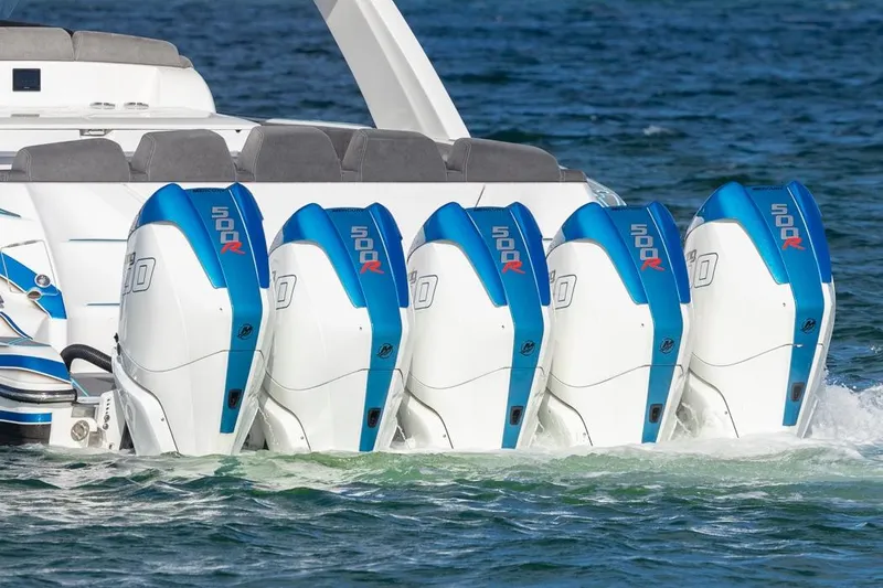 Slide: The Image of 2025 Deep Impact 499 Sport boat with five powerful outboard engines on water. - 4