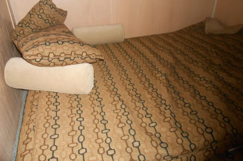 Slide: The Image of Cozy bed with patterned bedding in 1993 Stardust Cruisers 5715. - 10