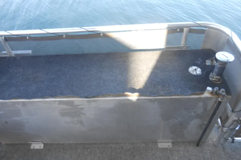 Slide: The Image of Deck area of a 1993 Stardust Cruisers 5715 houseboat with railing and water view. - 23