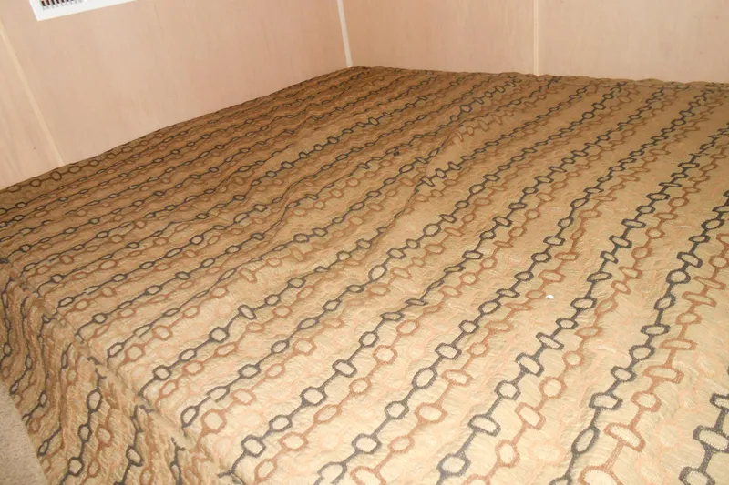 Slide: The Image of Patterned bedspread in a Stardust Cruisers 5715, 1993 model interior. - 9