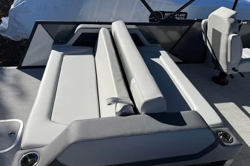 Slide: The Image of 2026 Alera M 23L boat interior with gray seating and cup holders. - 10