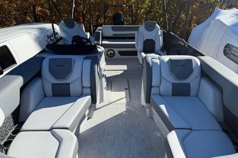 Slide: The Image of Luxurious interior of 2026 Alera M 23L boat with plush seating and modern design. - 14